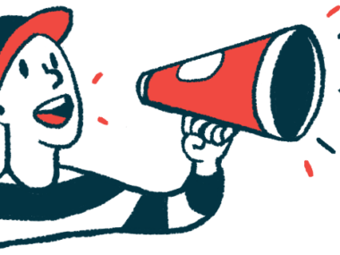 A person wearing a baseball cap speaks using a megaphone.