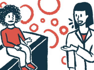 A medical professional talks with a child who's sitting on an examination table.