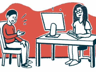 A doctor seated at a desk takes notes on a computer while a patient sitting in a chair speaks to them.