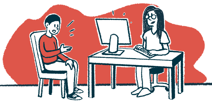 A doctor seated at a desk takes notes on their computer while a patient sitting in a chair speaks to them.
