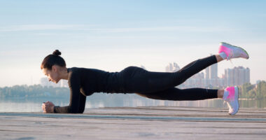 Woman doing a leg raise in a plank position