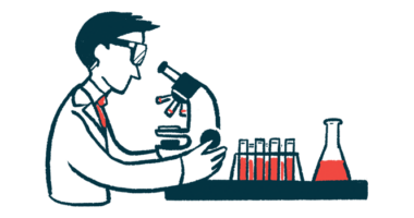 A researcher views slides through a microscope.