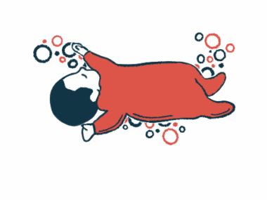 A baby in a onesie is shown sleeping.