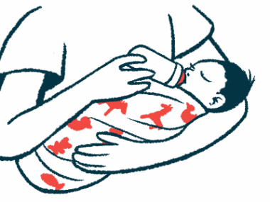 A woman cradles a baby in her arms as she feeds the child from a bottle.