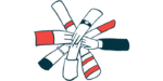 A group of hands touch in a circle.