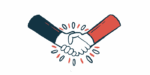 Two people's hands are seen in a handshake.