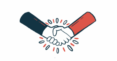 Two people's hands are seen in a handshake.