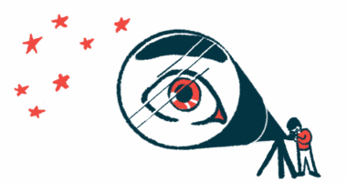 The eye of a person looking at the stars through a telescope is magnified in the lens of the instrument.