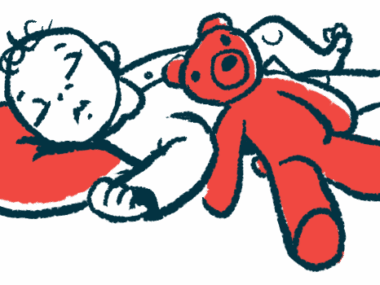 A red teddy bear rests on the side of a sleeping infant whose head is on a pillow.