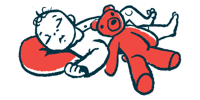 A red teddy bear rests on the side of a sleeping infant whose head is on a pillow.