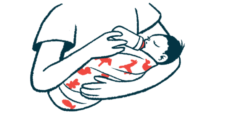 A baby in a person's arms drinks from a bottle.