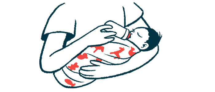 A baby in a person's arms drinks from a bottle.