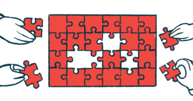 Four hands work on a puzzle.