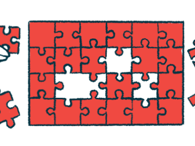 Four hands work on a puzzle.