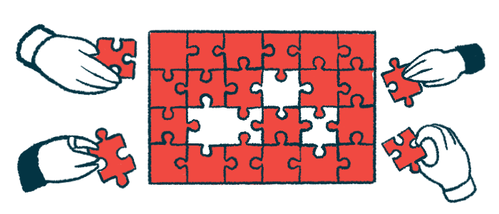 Four hands work on a puzzle.